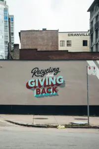 40 Ways to Repurpose Blog Content -- And Why You Should 5 a sign on the side of a building advertising giving back