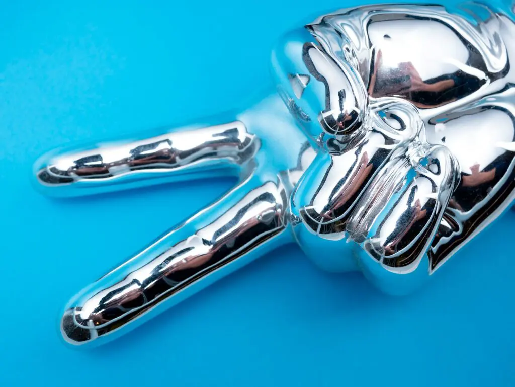 5 Digital Marketing Secrets for Writers 1 silver-colored hand in a peace sign