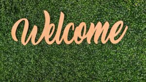 welcome sign on green background