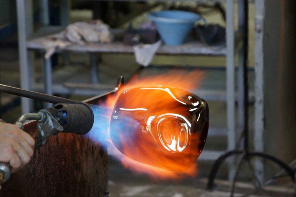 person holding torch and metal