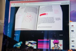 a computer screen with an open book on it